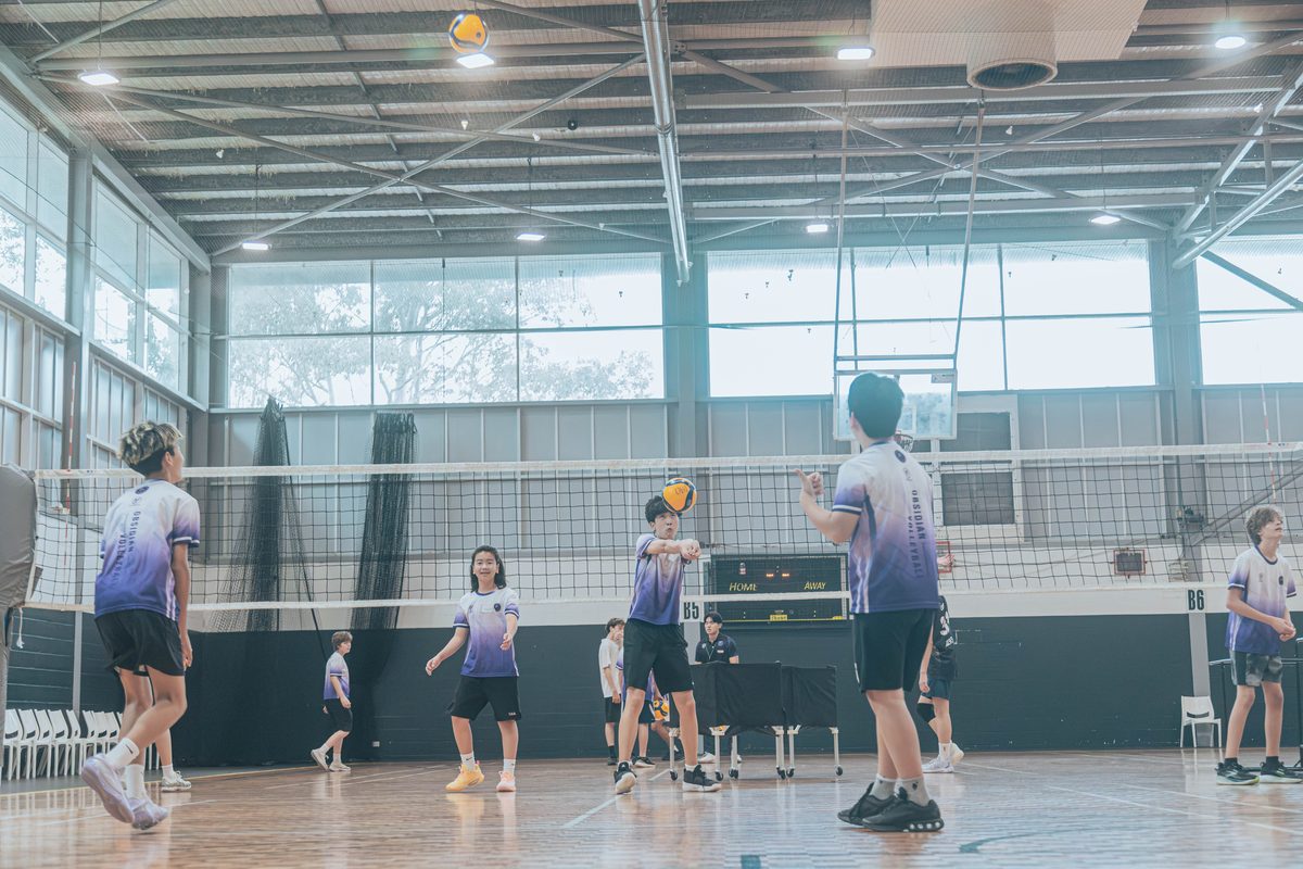 Wide view of a junior session at Ryde Aquatic Leisure Centre with players spread across the court